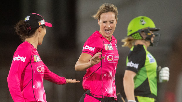 All-round excellence: Ellyse Perry reacts to taking the wicket of the Thunder's Alex Blackwell.