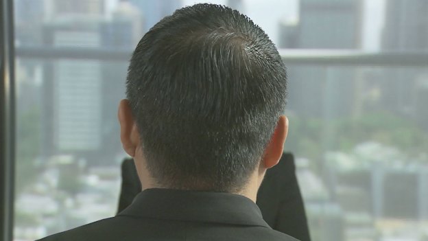 Koh agreed to appear on Four Corners and let us use his full name and position, but asked that we film only the back of his head.