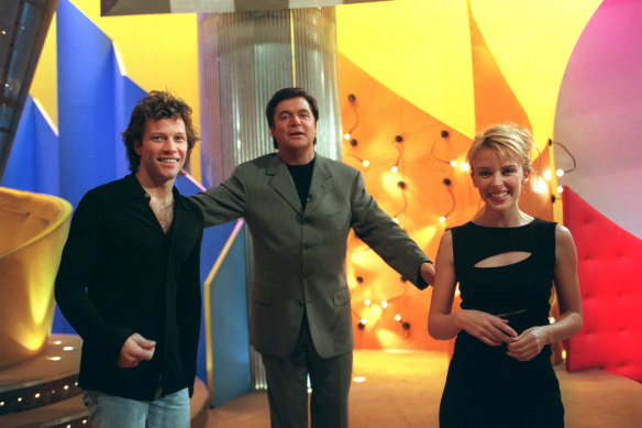 Kylie Minogue and Jon Bon Jovi with Daryl Somers on set of Hey Hey in 1997