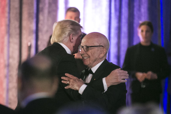 Rupert Murdoch and then US president Donald Trump embrace at a function in 2017.