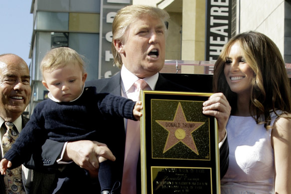 Donald Trump, pictured with Melania and baby Barron in 2007 when Trump received a star on the Hollywood Walk of Fame.