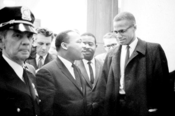 Martin Luther King jnr and Malcolm X wait for a press conference in March 1964. 