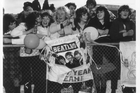 Fans greet the Beatles on their arrival at Essendon Airport in 1964.