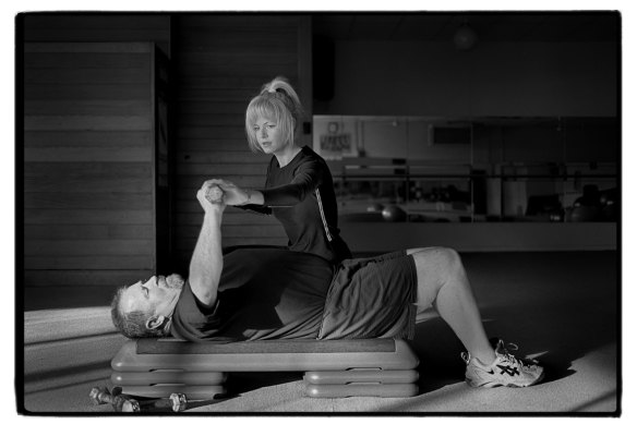 Personal trainer Cathy Purcell working with Twentyman in a Brighton gym.