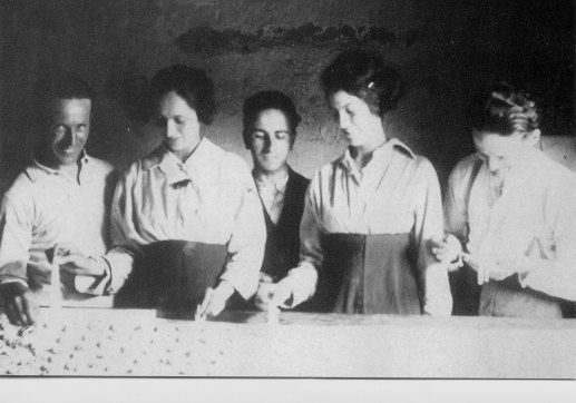 Giacomo Lucini’s granddaughters, Marie and Rosa, with unknown workers, circa 1920s.