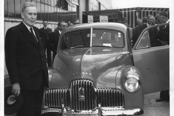 Ben Chifley, left, released the 1945 budget just days after the end of World War II. Four years later, he was on hand to see the first Australian-made car roll off the Holden assembly line in Melbourne.