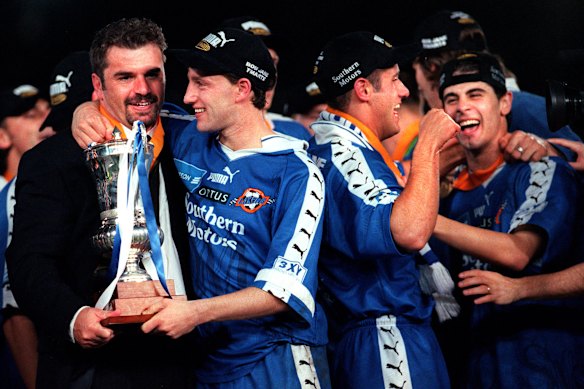 Ange Postecoglou (left) in 1998 after coaching South Melbourne to a win over Carlton in the NSL grand final.