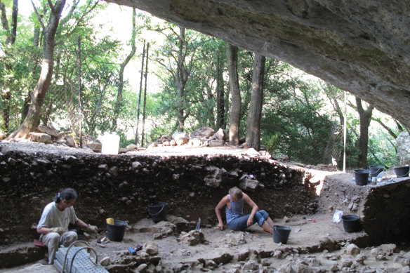 Scientists work at the entrance of the Mandrin cave, near Montelimar, southern France.