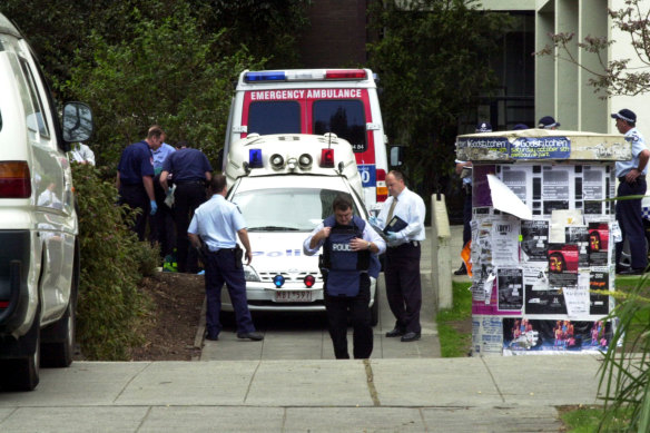 A police car sits outside of the Menzies Building where the shootings took place.