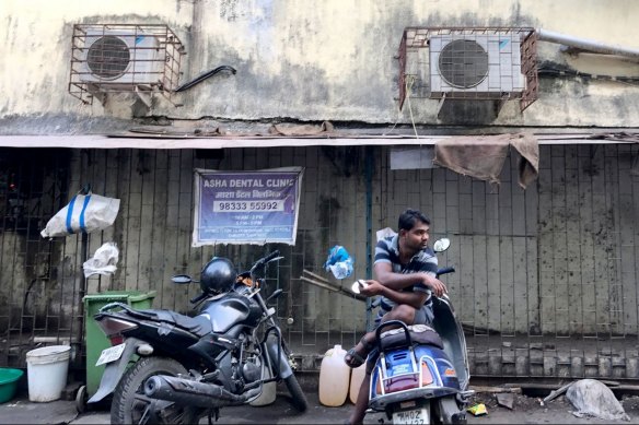 Air-conditioning units, like these shown outside a building in Mumbai, account for more than 40 per cent of the peak summer energy load in major Indian cities. 