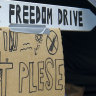 A signpost is erected outside a tent during a protest at Parliament in Wellington, New Zealand, on Wednesday.