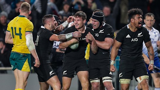 Dark night at the office: The All Blacks congratulate George Bridge on his first Test try.