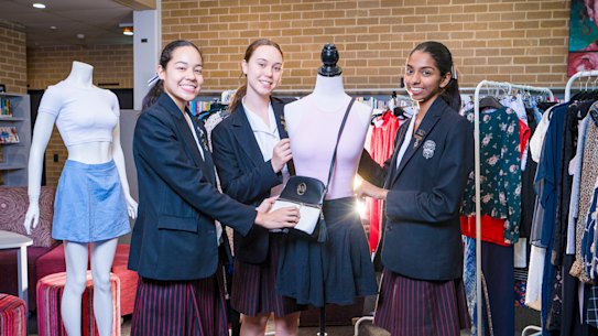 Year 12 Santa Sabina College students Lucia Juarez, left, Lucy Gee, centre, and Rochelle Dias are part of a group running their own op shop.