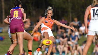 Clearing the pack: Elle Bennetts send a kick forward for the Giants during the round one AFLW clash at Moreton Bay Central Sports Complex in Brisbane.