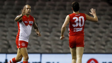Lance Franklin celebrates with Tom McCartin.