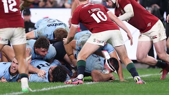 Ethan Dobbins of the Waratahs scores a try during the tour match.