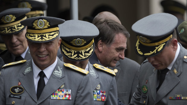 Brazil's President Jair Bolsonaro pictured with Army officers in December. Bolsonaro is a former Army captain.