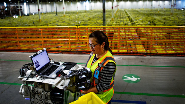 Julia Teran scans packages at the Amazon Fulfillment Center in Carteret, New Jersey.