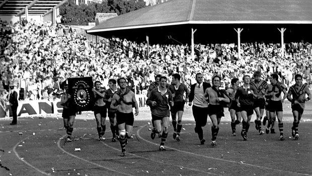 September reign: Balmain players parade the trophy on a lap of honour at the SCG after winning the 1969 grand final.