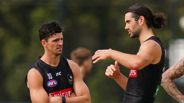 Coming to terms: Pies stars including captain Scott Pendlebury (left) and ruckman Brodie Grundy face uncertainty on the contract front.