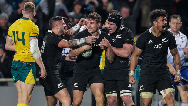 Dark night at the office: The All Blacks congratulate George Bridge on his first Test try.