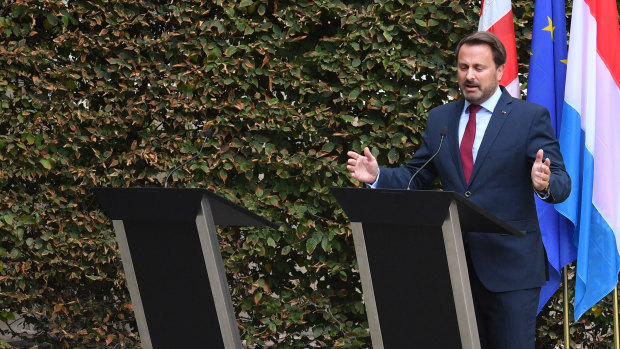Xavier Bettel, Luxembourg's Prime Minister, beside the empty podium of British Prime Minister Boris Johnson.