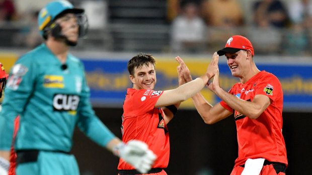On a roll: Renegades' Cameron Boyce (centre) celebrates after claiming the wicket of the Heat's Matthew Renshaw.