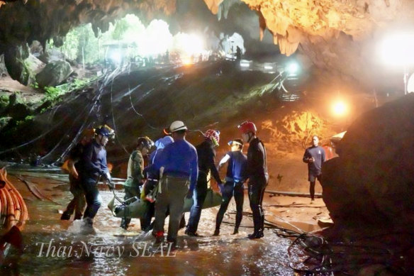 One of the boys is stretchered out of the Tham Luang cave, an expansive cave network that now also houses a museum.