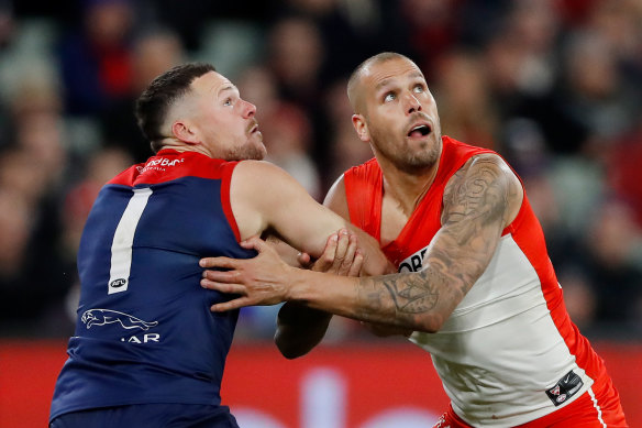 Steven May of the Demons and Sydney’s Lance Franklin square up on Friday night.