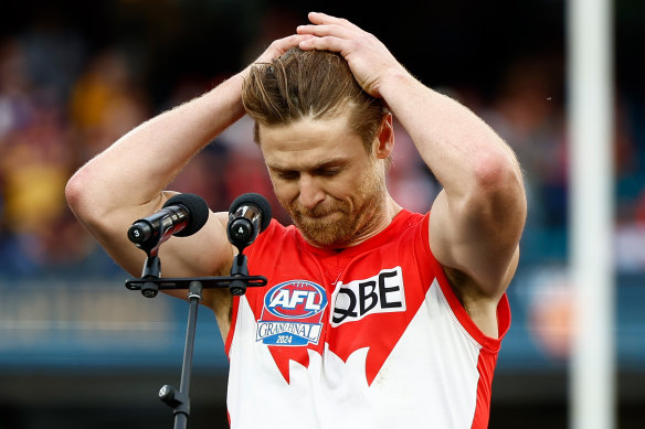 A dejected Dane Rampe speaks on stage after going down to the Lions.