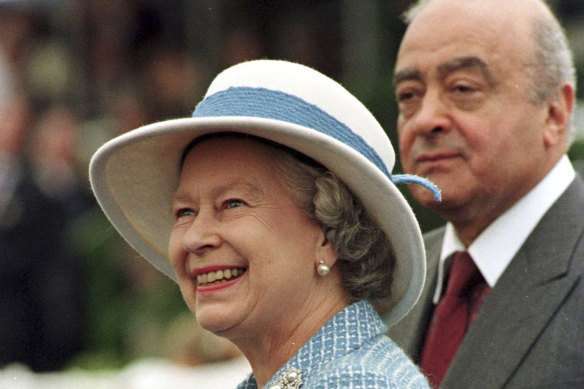 Queen Elizabeth II accompanied by the then owner of Harrods, Mohamed Al Fayed, at the 1997 Royal Windsor Horse Show.