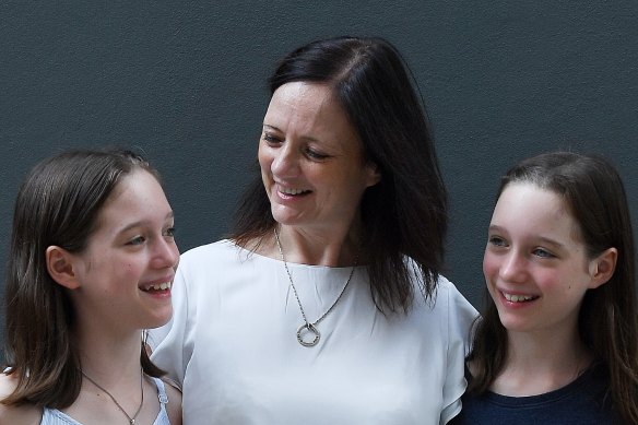 Kerry-Anne Baxter with her daughters Rosie, left, and Ellie, who fell with flu and will now be vaccinated every year.