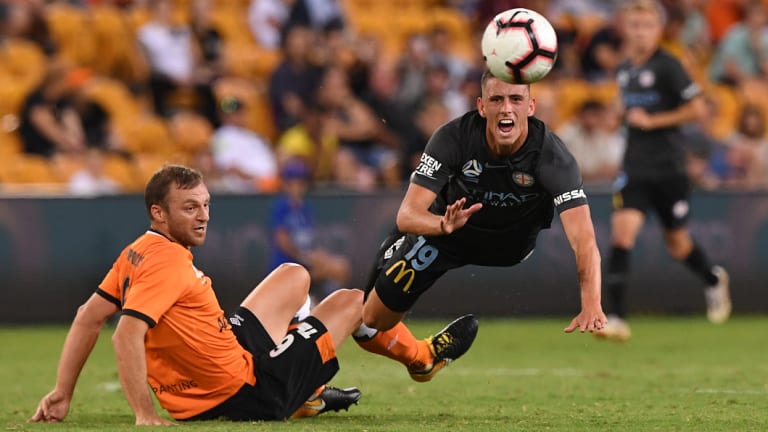 City's Lachlan Wales is brought down by Avram Papadopoulos of the Roar.