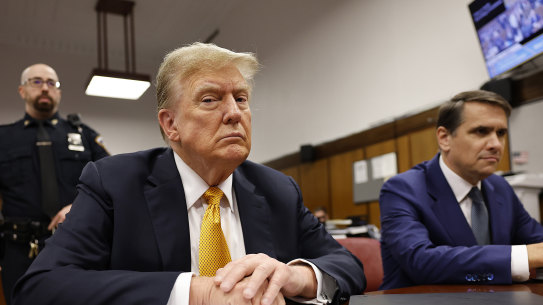Former president Donald Trump sits in the courtroom for his hush money trial at the Manhattan criminal court 