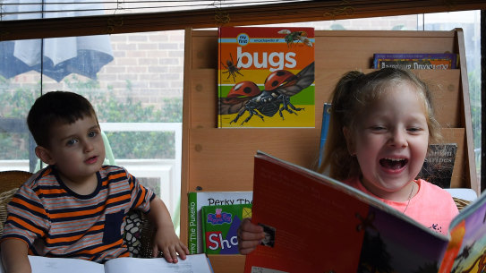 Zahra Khodr aged 4 (right) and Benjamin Perovic aged 3 (left) reading whilst at Goodstart Early Learning West Ryde - Winbourne Street, West Ryde, Sydney, NSW. 20th February, 2019. Photo: Kate Geraghty