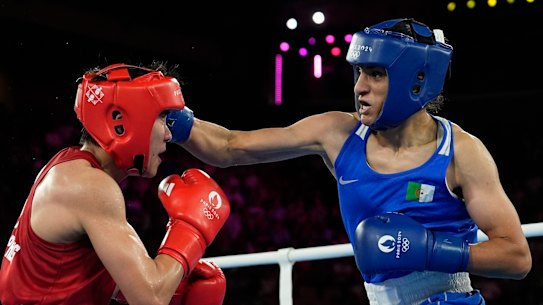 Imane Khelif, right, lands a right hook on Thailand’s Janjaem Suwannapheng.