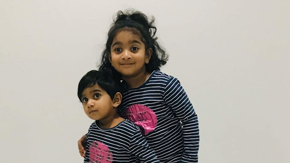 Tharunicaa, left, is pictured with her four-year-old sister Kopika.