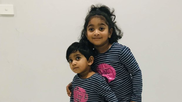 Tharunicaa, left, is pictured with her four-year-old sister Kopika.