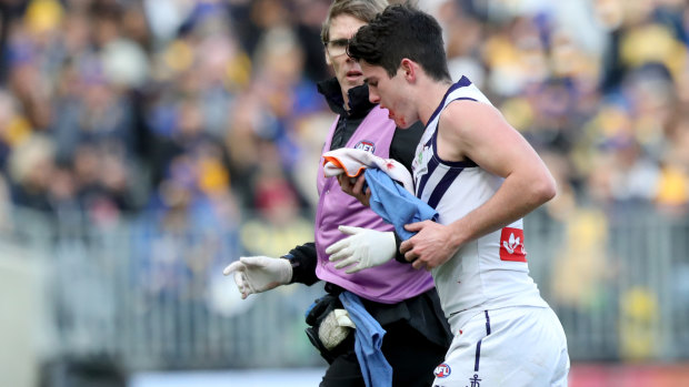 Andrew Brayshaw of the Dockers leaves the field after clash with West Coast's Andrew Gaff.