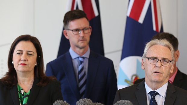 Premier Annastacia Palaszczuk, Transport Minister Mark Bailey and retired District Court judge Michael Forde.