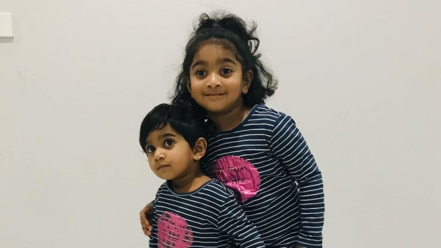 Tharunicaa, left, is pictured with her four-year-old sister Kopika.