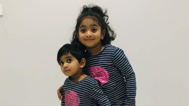 Tharunicaa, left, is pictured with her four-year-old sister Kopika.