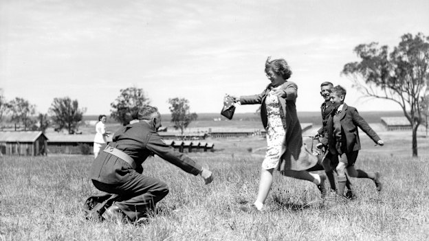Homecoming: a POW who came by Largs Bay, South Australia, is reunited  with his family at Ingleburn in September, 1945.