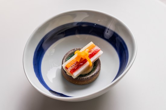Naengchae made from cold assorted vegetables with cured egg yolk.