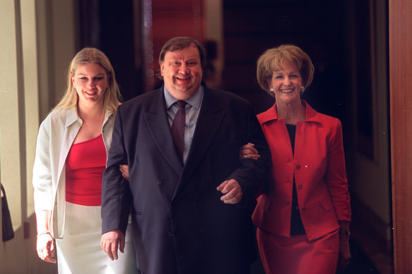 In happier days with wife Bevelly, from whom he is divorced, and daughter Amanda. 