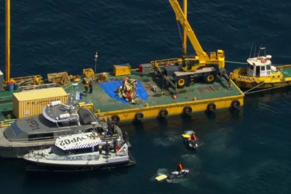 The wreck of the crashed jet on a barge in Port Phillip Bay on Saturday.