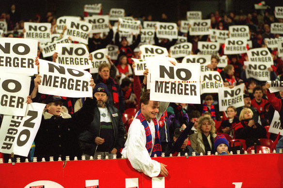 Melbourne fans show their opposition to the merger. 