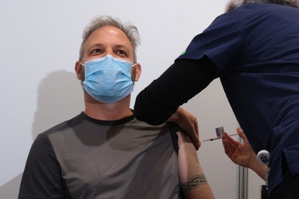 Sutton receives his first COVID-19 vaccination at the Royal Exhibition Building in April 2021.