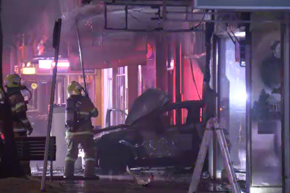 Firefighters contained the blaze to the vehicle and the front of the Altona store on Friday morning.