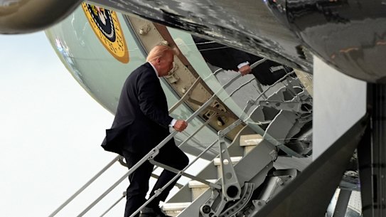 Donald Trump boards Air Force One on Sunday.